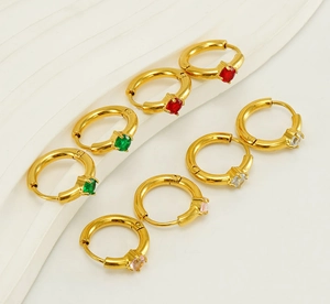 Close-up of 18K gold plated stainless steel hoops with vibrant inlaid zircons