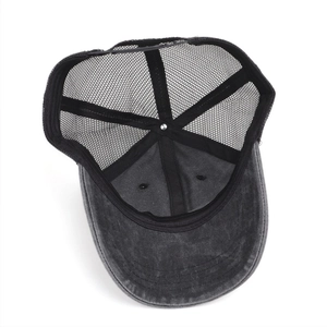 Detail of adjustable strap and breathable mesh on black washed vintage trucker cap