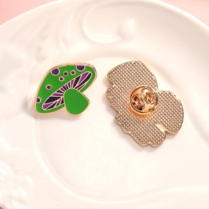 Cute green enamel mushroom brooch with purple spots and gold butterfly clutch back