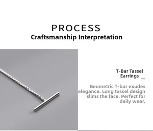 Macro detail of silver T-bar drop earring chain showing craftsmanship and sleek finish