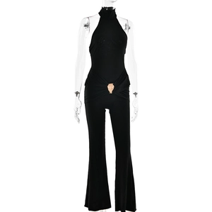 Detail view of black high neck romper with waist metal buckle and flared legs on mannequin