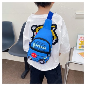 Detail view of the blue school bus pattern children's chest bag worn by a model