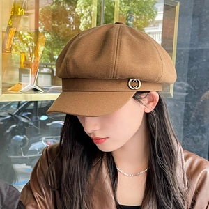 Classic brown wool octagonal newsboy hat for women with a vintage metal button detail