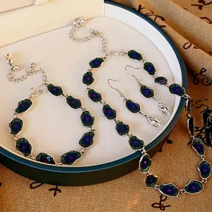 Elegant Neo-Chinese jewelry set featuring enamel lotus leaf necklace, bracelet, and earrings