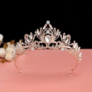 Luxurious rose gold bridal crown with shimmering diamonds and baroque hollow design