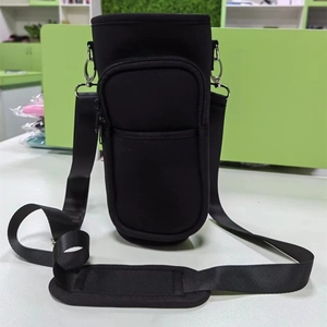 Detail of black neoprene cup sleeve featuring an adjustable strap and zipper pocket