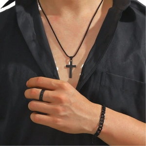 Men's black cross pendant necklace set with Cuban link bracelet and cutout ring on model