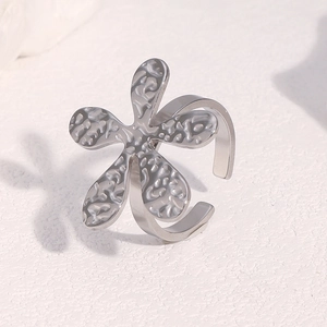 Silver flower open ring with embossed petal texture in a minimalist aesthetic style