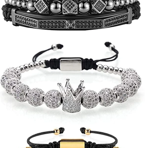 Detailed view of 4-piece bracelet set featuring crown charm and zircon stone inlays