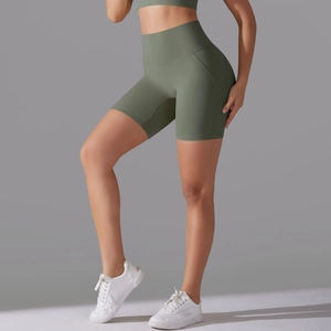 Detail view of olive green high-waisted seamless yoga shorts showing squat proof fabric