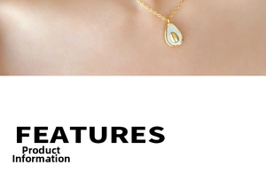 Detailed close-up of avocado-shaped pendant with gold frame and mother of pearl inlay