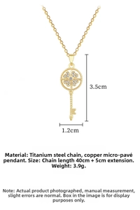Detail view of gold-plated titanium clover key necklace with sparkling zirconia stones