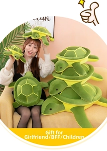 Collection of plush sea turtle pillows in various sizes shown in a cozy home setting