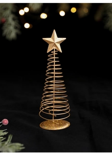 Close-up of golden iron spiral Christmas tree decoration with star on bokeh background