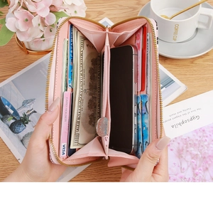 Pink faux leather long wallet detail showing multiple card slots and phone pocket