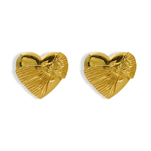 Close-up of gold heart earrings with textured ribbon design and metallic luster