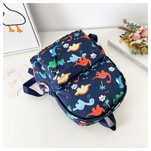 Detail of blue kids dinosaur backpack with vibrant cartoon prints and zipper pockets