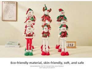 Macro detail of Christmas plush dolls with sequined clothes and telescopic legs decoration