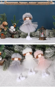Three plush Christmas angel dolls in grey white and pink with tulle skirts and tinsel wings