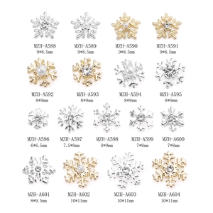 Golden and silver alloy snowflake nail charms set with rhinestones for winter manicure