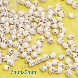 Detailed macro view of 7mmx9mm skull-shaped synthetic white turquoise beads for DIY jewelry