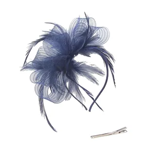 Detail of navy mesh bow fascinator with feathers and silver clip accessories