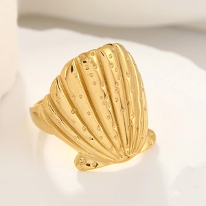 Detailed close-up of a gold shell-shaped pleated titanium steel ring with textured lines