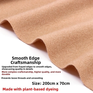 Detail of camel wool cashmere scarf showing raw edge technique and 200x70cm size