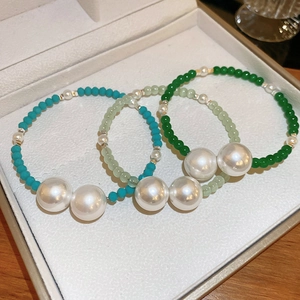 Three-piece turquoise and emerald green beaded bracelets with elegant faux pearls