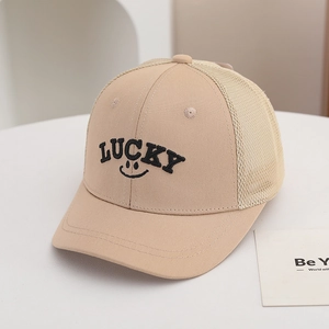 Detailed close-up of beige mesh baseball cap with LUCKY embroidery and breathable net