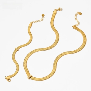 Close-up of gold stainless steel herringbone chain set with zircon rectangle slider
