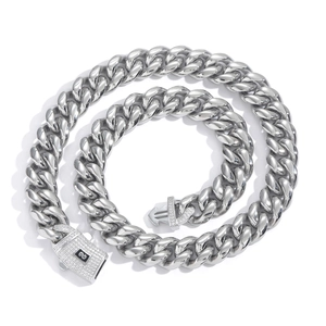 Detailed shot of silver heavy curb chain necklace with a zircon encrusted box clasp