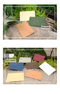 Close-up of assorted mini envelopes with triangle flap and premium linen texture paper