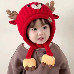 Red Christmas deer knit hat for kids with warm ear flaps and brown antlers