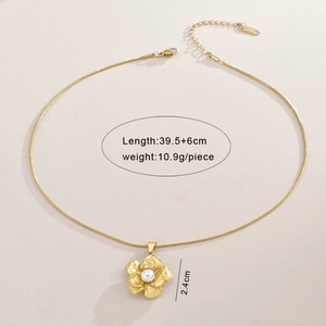 Detail view of a gold camellia necklace with pearl center including 39.5+6cm chain length