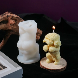 Detailed view of flexible silicone mold alongside a lifelike teddy dog candle with hair texture