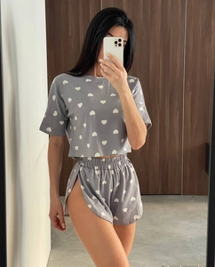 Detail of light grey pajama set with white heart prints and elastic waist shorts