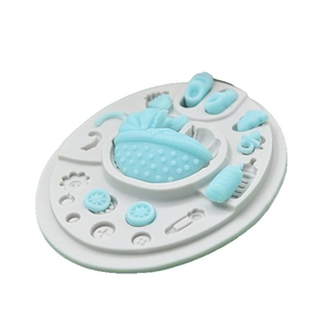 Baby shower silicone fondant mold featuring stroller, shoes, and bottle for cake decorating