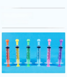 Detail view of 5ml colorful plastic oral syringes with precise ml and tsp scale markings