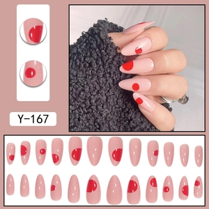 Almond-shaped nude press-on nails with red polka dot pattern, 24-piece full set
