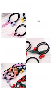 Detail showing elastic hair ties with cherry beads and patterned ribbon bow ties