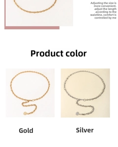Detail of punk style metal waist chain belt with sun pendants in gold and silver finish