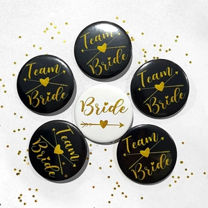 Tinplate Team Bride to Be badges set with gold lettering and decorative gold stars