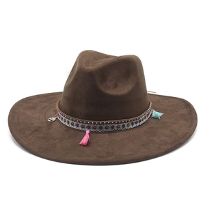 Close-up of brown wide brim fedora with colorful tassels and silver tree of life pendant