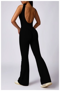 Detail showing the U-shaped open back and scrunch design of the black yoga bodysuit