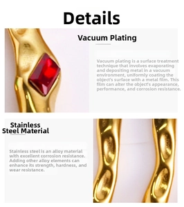 Detailed close-up of gold-plated stainless steel cuff with a red zircon stone inlay