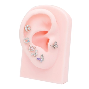 Detail view of 6-piece silver ear stud set with colorful zircon butterfly and star shapes