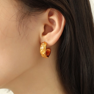 French vintage style C-shaped gold hoop earrings with sun moon star relief patterns