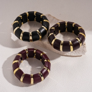 Chunky acrylic stretch bracelet set in black burgundy and brown with gold metal accents