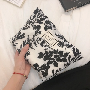 Floral bubble cotton handbag with Time to Party label shown in a lifestyle home setting